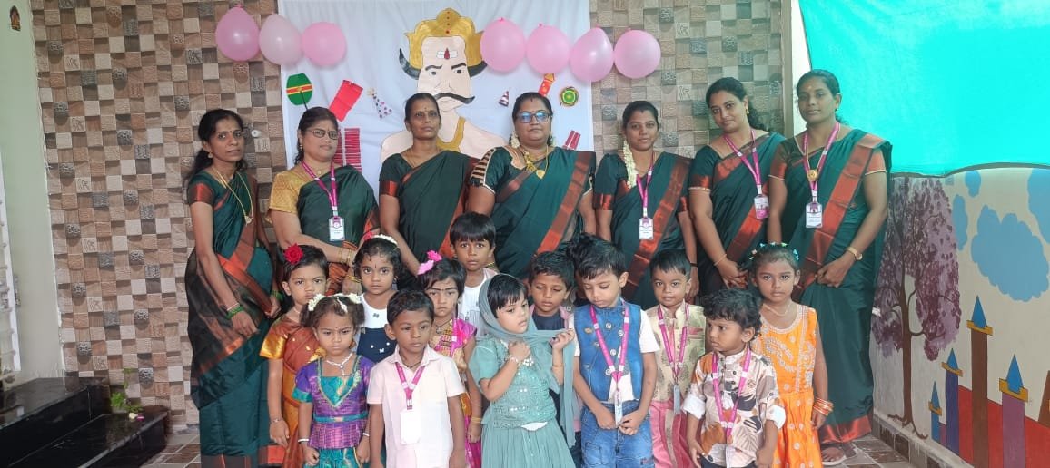 Drizzling Preschool students and teachers celebrating together